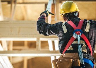 A construction worker building a house