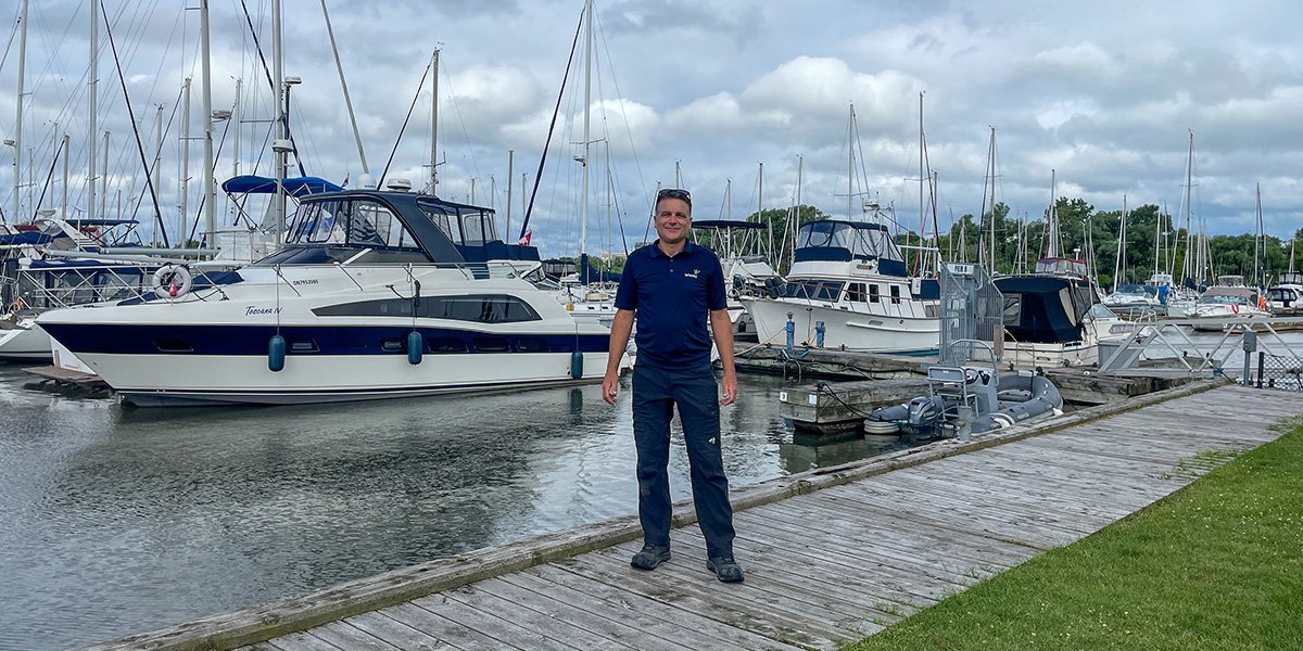 Keenan Watters standing in front of Whitby Marina