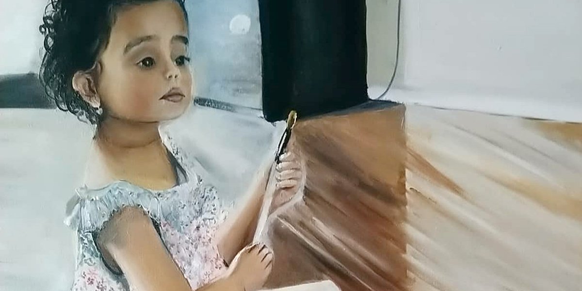 Young girl with paints