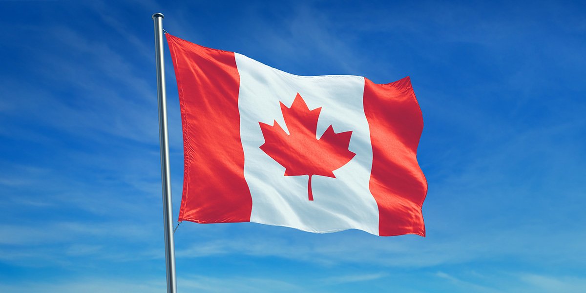 A Canadian flag blowing in the wind