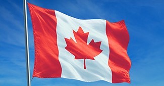 A Canadian flag blowing in the wind